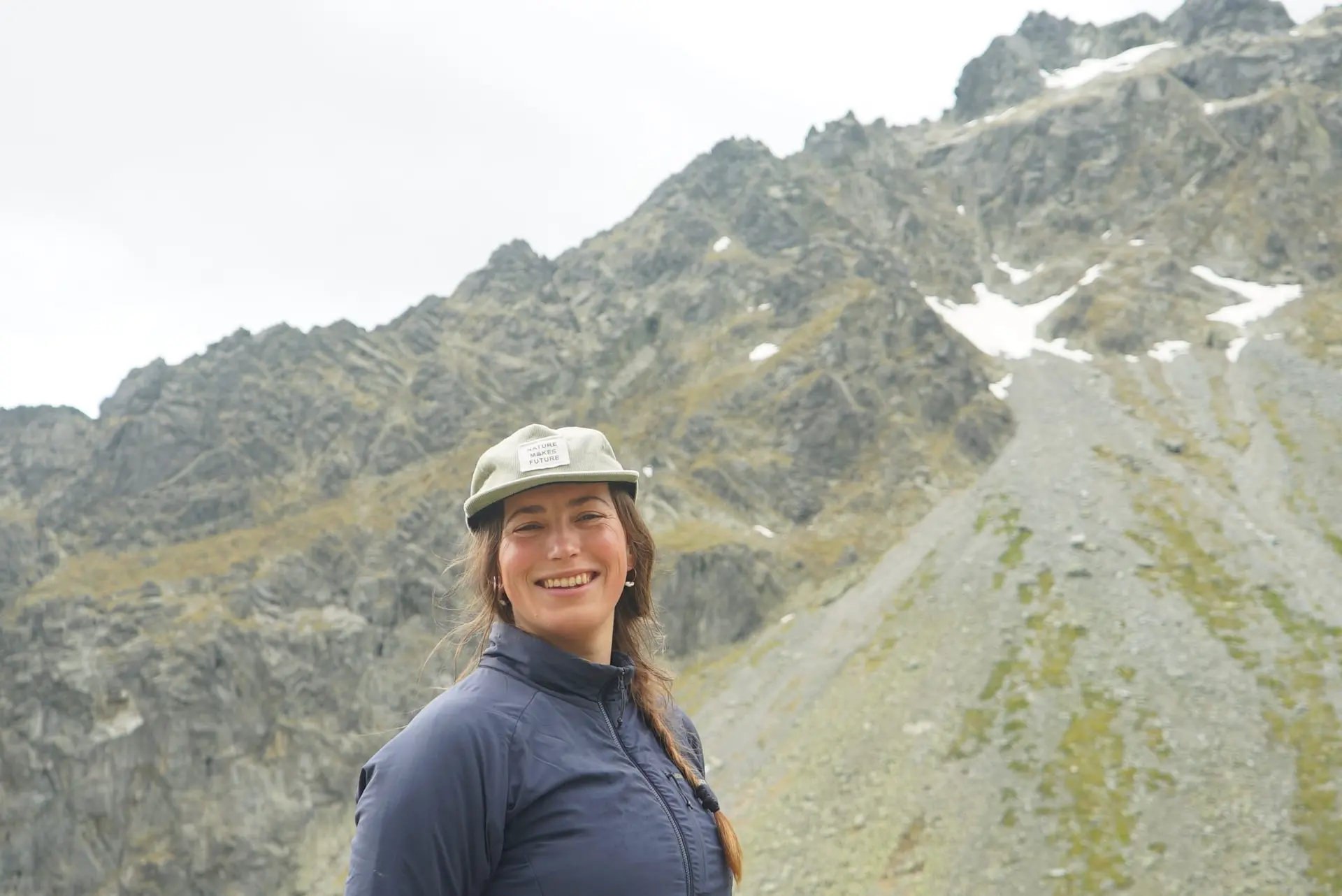 Kristína Turčanová smiling, with the High Tatras behind her